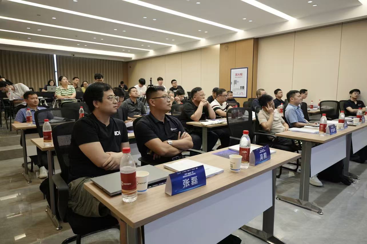 Audience attending the VINGLOOP AV-over-IP International Standards and Network Design training seminar in a conference room.